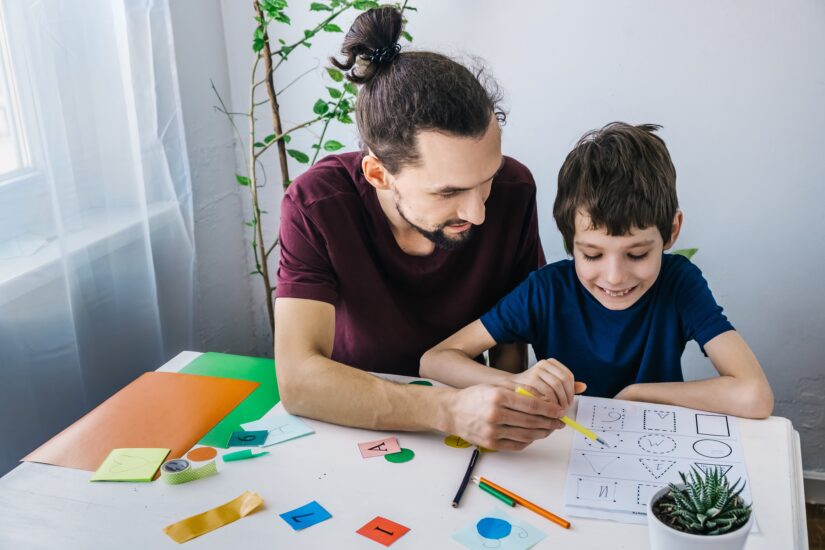 Father and Child Drawing Shapes Together